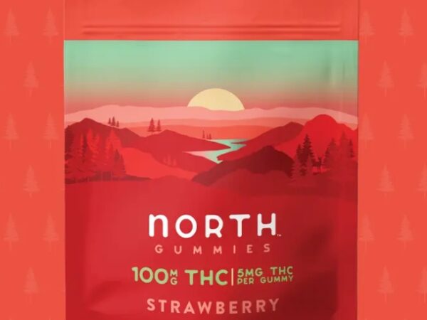A retro-style label for North Thick Strawberry with a sunset landscape.